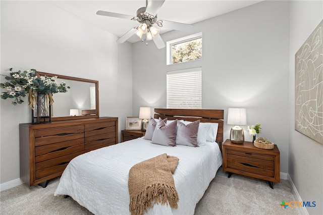 bedroom featuring baseboards, a ceiling fan, and carpet flooring