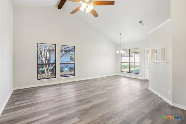 empty room featuring ceiling fan with notable chandelier, beam ceiling, dark wood-type flooring, and high vaulted ceiling