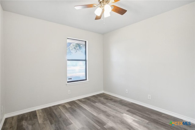 empty room with ceiling fan and dark wood-type flooring