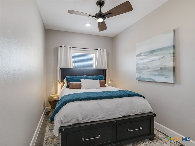 bedroom featuring hardwood / wood-style flooring and ceiling fan