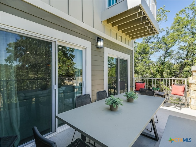 view of patio / terrace with a balcony