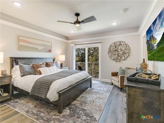 bedroom featuring ceiling fan, dark hardwood / wood-style floors, and access to exterior