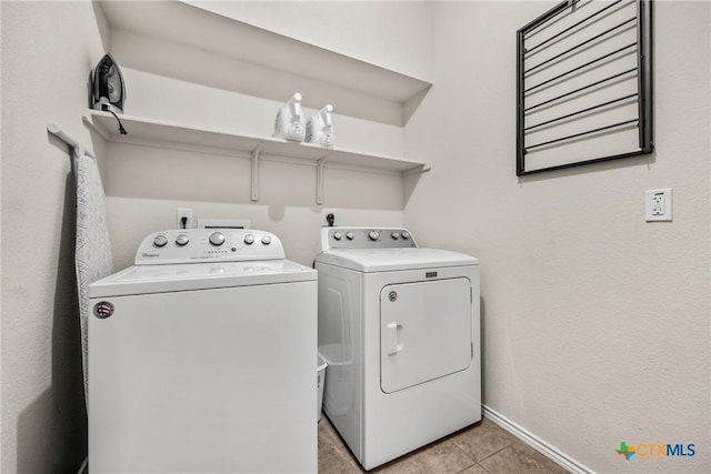 3610 Parkmill Dr, Killeen, TX 76542 - laundry area with washing machine and dryer, light tile patterned flooring, and baseboards