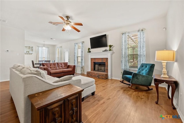 3610 Parkmill Dr, Killeen, TX 76542 - living area with healthy amount of natural light, light wood-style flooring, ceiling fan, and baseboards