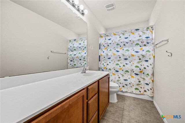 3610 Parkmill Dr, Killeen, TX 76542 - bathroom featuring vanity, toilet, tile patterned flooring, baseboards, and a shower with curtain