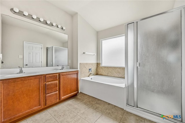3610 Parkmill Dr, Killeen, TX 76542 - bathroom featuring a stall shower, a garden tub, tile patterned floors, and double vanity