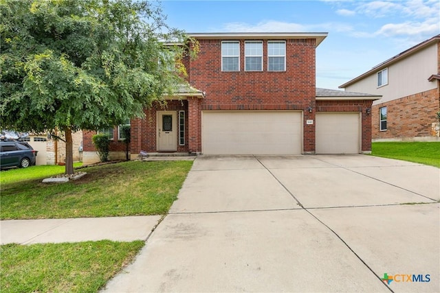 3610 Parkmill Dr, Killeen, TX 76542 - traditional-style house featuring driveway, a front yard, brick siding, and a garage