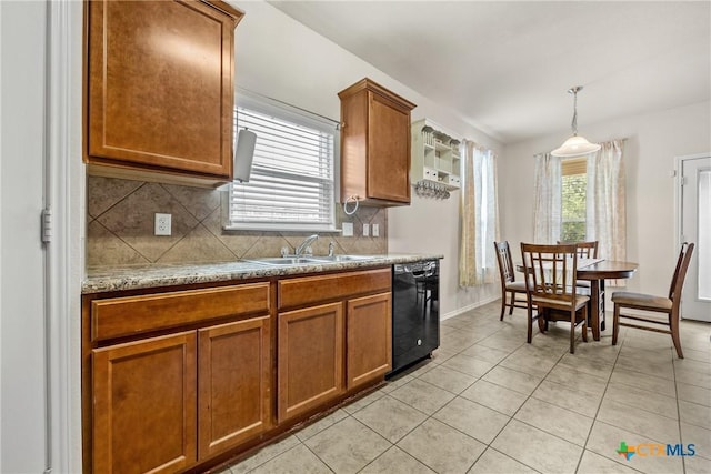 3610 Parkmill Dr, Killeen, TX 76542 - kitchen with dishwasher, brown cabinets, backsplash, and a sink