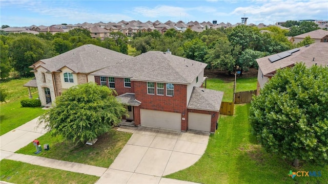 3610 Parkmill Dr, Killeen, TX 76542 - view of front of house featuring concrete driveway, a residential view, a garage, roof with shingles, and brick siding