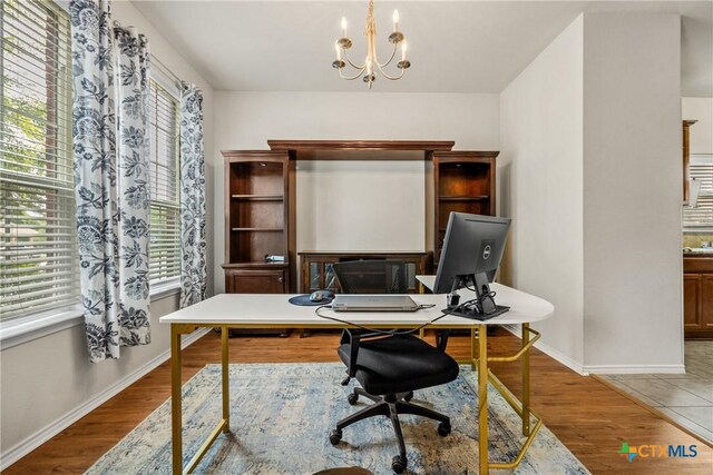 3610 Parkmill Dr, Killeen, TX 76542 - office featuring wood finished floors, baseboards, and a chandelier