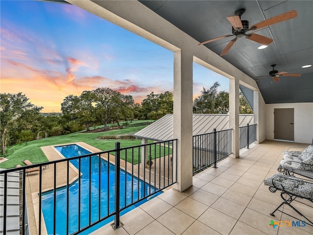 exterior space featuring ceiling fan, a patio, and a yard