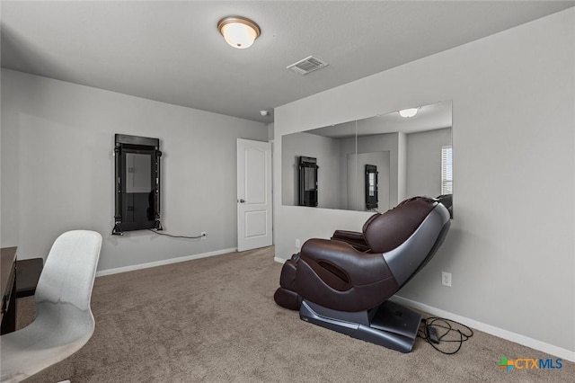 sitting room featuring visible vents, baseboards, and carpet flooring