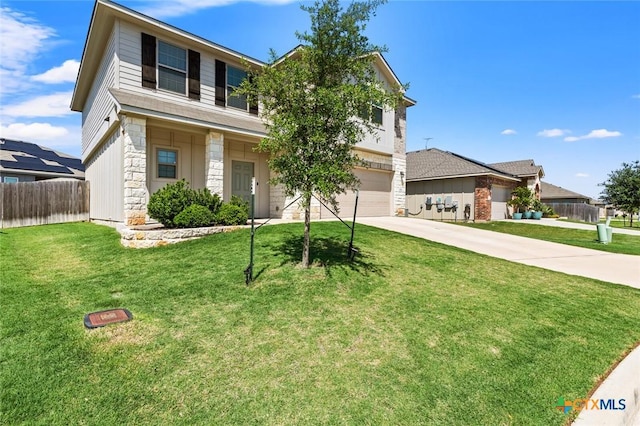 view of front of home featuring driveway, stone siding, and a garage