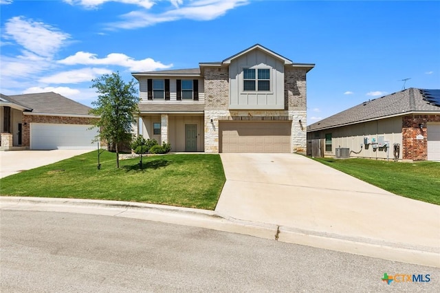 view of front facade with board and batten siding, concrete driveway, stone siding, central AC, and a front yard