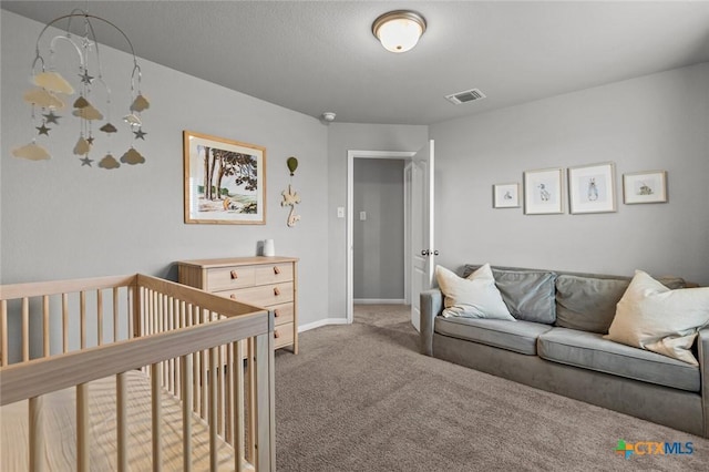 bedroom featuring visible vents, baseboards, and light colored carpet