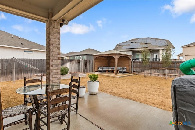 view of patio with grilling area, an outdoor living space, a gazebo, a fenced backyard, and outdoor dining space