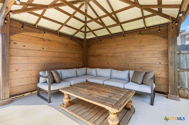 living area featuring wooden walls