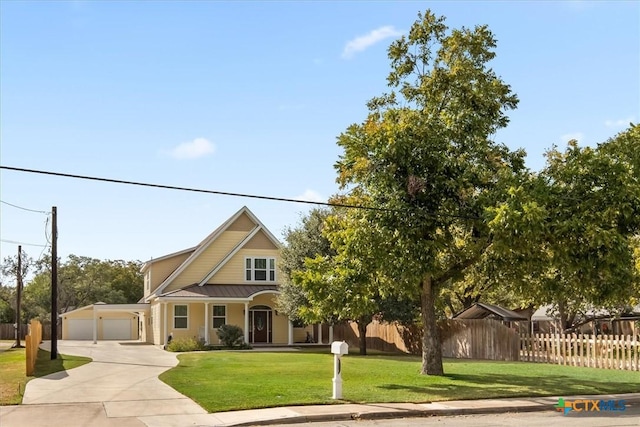 view of front of home featuring a front yard and a garage