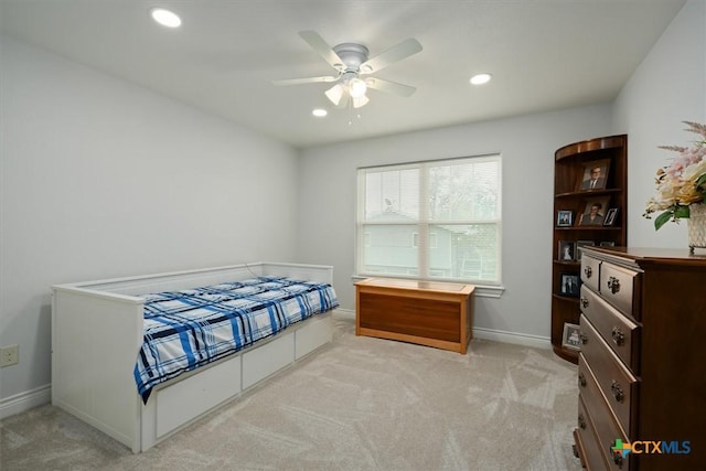 bedroom featuring ceiling fan and light carpet