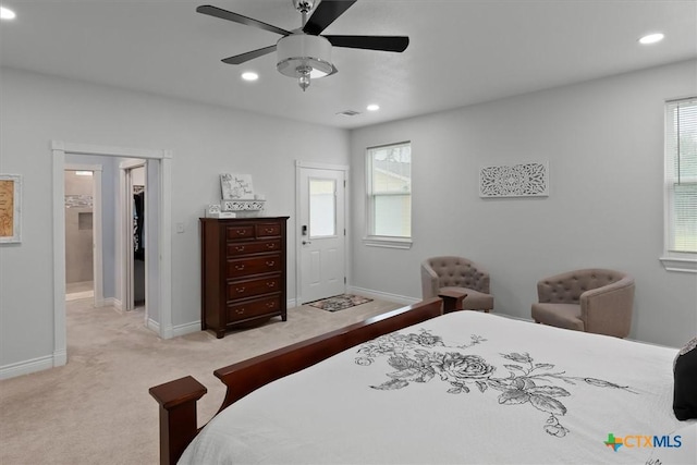 bedroom with ceiling fan and light carpet