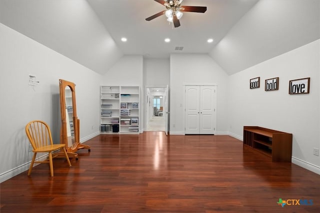 interior space with lofted ceiling, ceiling fan, and dark hardwood / wood-style flooring