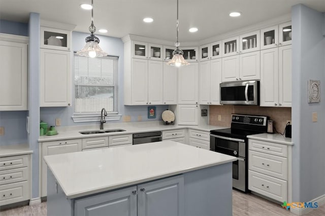 kitchen with stainless steel appliances and white cabinets