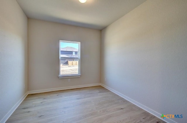 spare room with light hardwood / wood-style floors