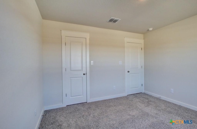 view of carpeted spare room