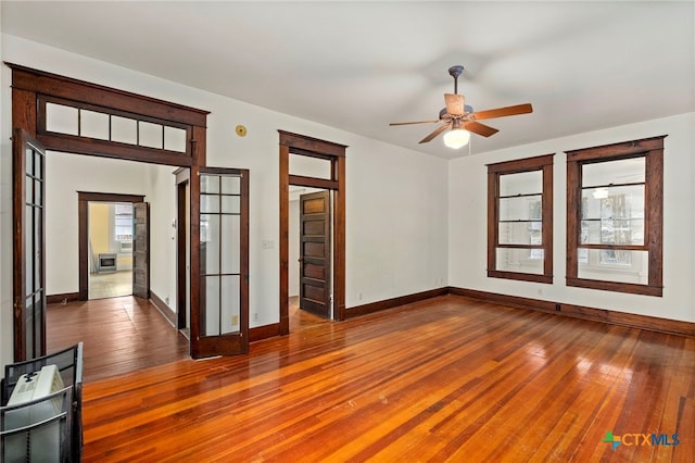 empty room featuring dark hardwood / wood-style floors and ceiling fan