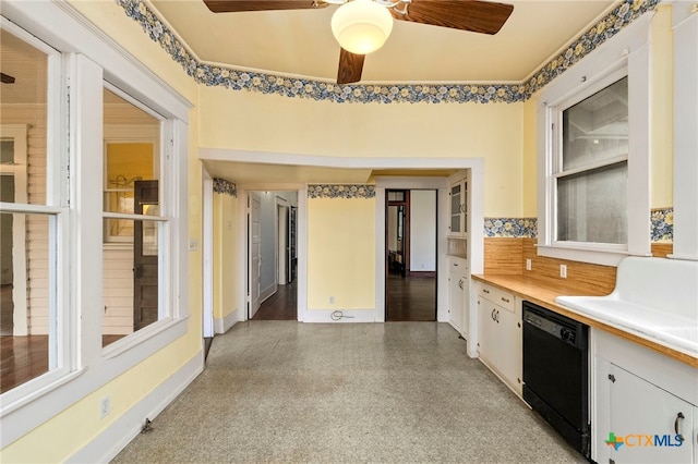 kitchen featuring white cabinetry, dishwasher, backsplash, and ceiling fan