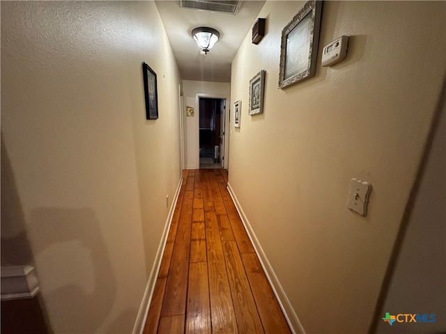 hall featuring wood-type flooring