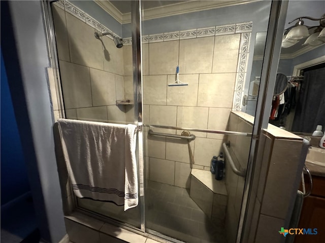 bathroom with ornamental molding and a shower with door