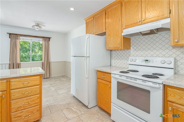 kitchen with white appliances, light stone counters, and ornamental molding