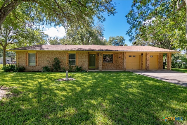 single story home with a garage and a front yard