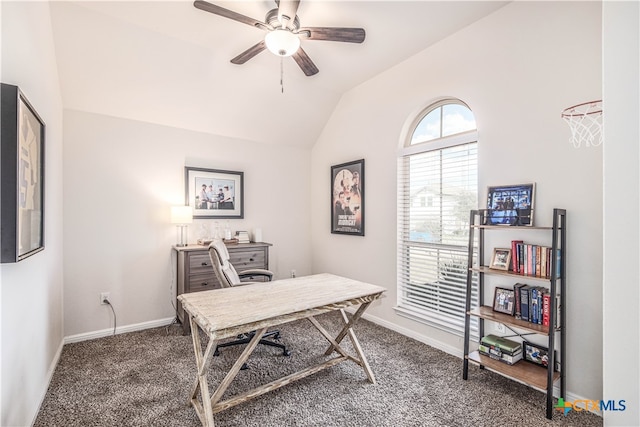 office area with dark colored carpet, ceiling fan, and vaulted ceiling