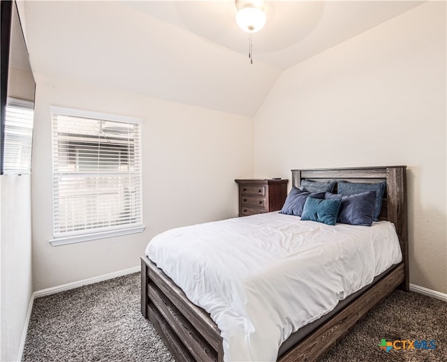 carpeted bedroom featuring lofted ceiling and ceiling fan