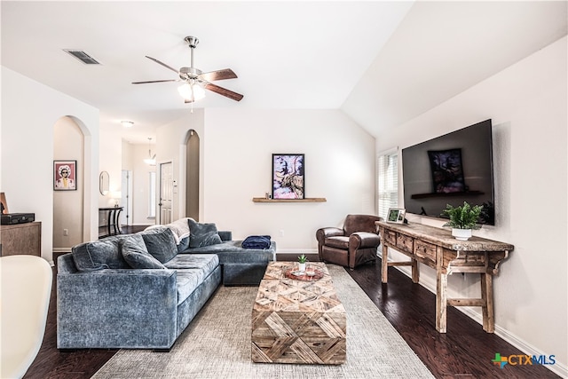 living room with ceiling fan, dark hardwood / wood-style floors, and lofted ceiling