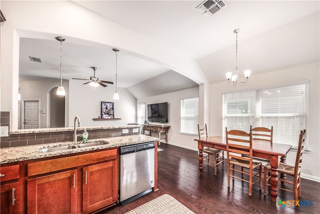 kitchen with dark hardwood / wood-style flooring, stainless steel dishwasher, lofted ceiling, and sink