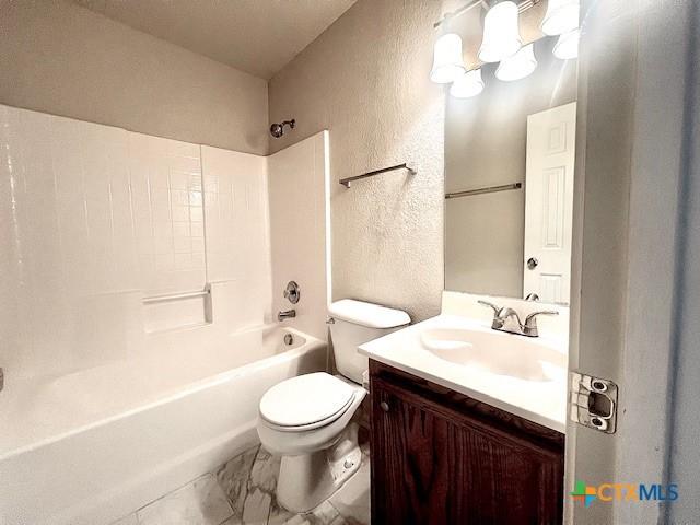 full bathroom featuring vanity, toilet, and tub / shower combination