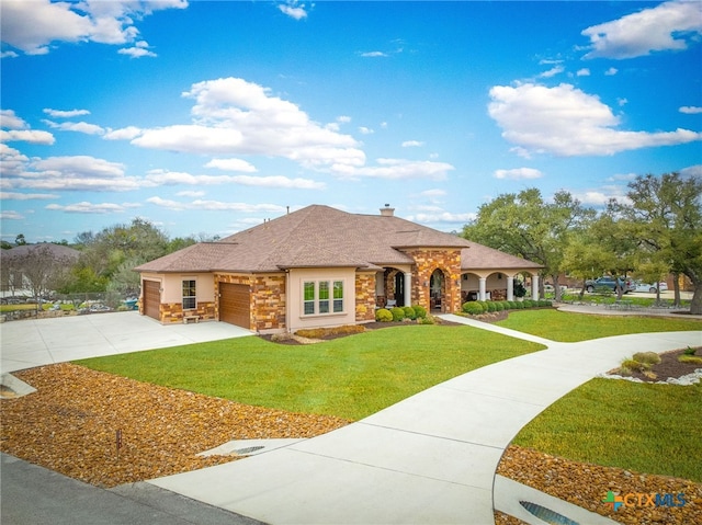 view of front of property featuring an attached garage, stone siding, concrete driveway, a front lawn, and a chimney