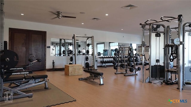 gym with recessed lighting, wood finished floors, visible vents, and a ceiling fan