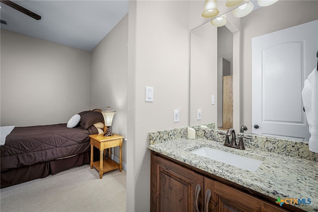 bedroom with light carpet, a sink, and visible vents