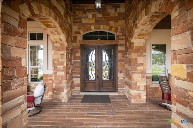 entrance to property featuring french doors