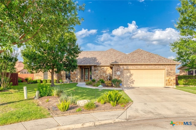 2299 Sun Chase Blvd, New Braunfels, TX 78130 - view of front of home featuring an attached garage, driveway, brick siding, and a shingled roof