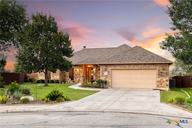 2299 Sun Chase Blvd, New Braunfels, TX 78130 - view of front of house with concrete driveway, a garage, a shingled roof, and brick siding