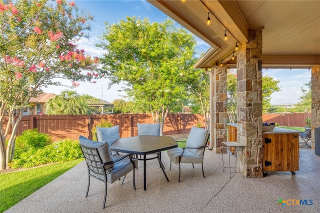 2299 Sun Chase Blvd, New Braunfels, TX 78130 - fenced backyard featuring a patio area and outdoor dining area