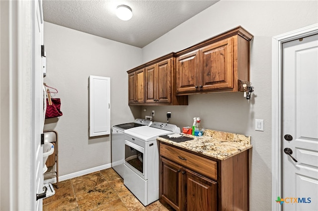 2299 Sun Chase Blvd, New Braunfels, TX 78130 - laundry area featuring cabinet space, separate washer and dryer, and a textured ceiling