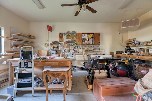 2299 Sun Chase Blvd, New Braunfels, TX 78130 - miscellaneous room with a workshop area, ceiling fan, and concrete floors