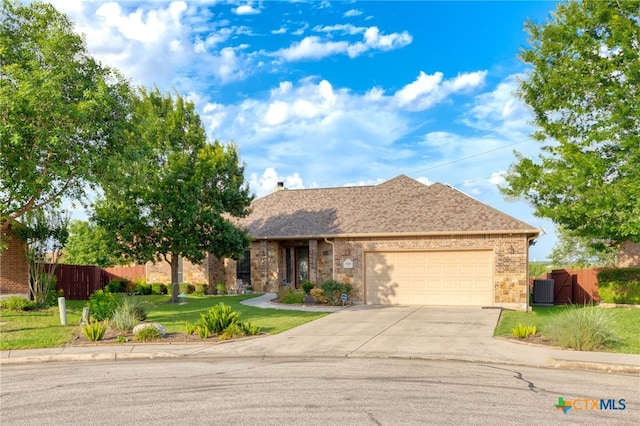 2299 Sun Chase Blvd, New Braunfels, TX 78130 - view of front facade with driveway, a garage, brick siding, and a shingled roof