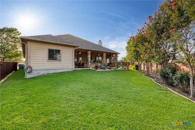2299 Sun Chase Blvd, New Braunfels, TX 78130 - rear view of property with a patio area, a fenced backyard, and a chimney